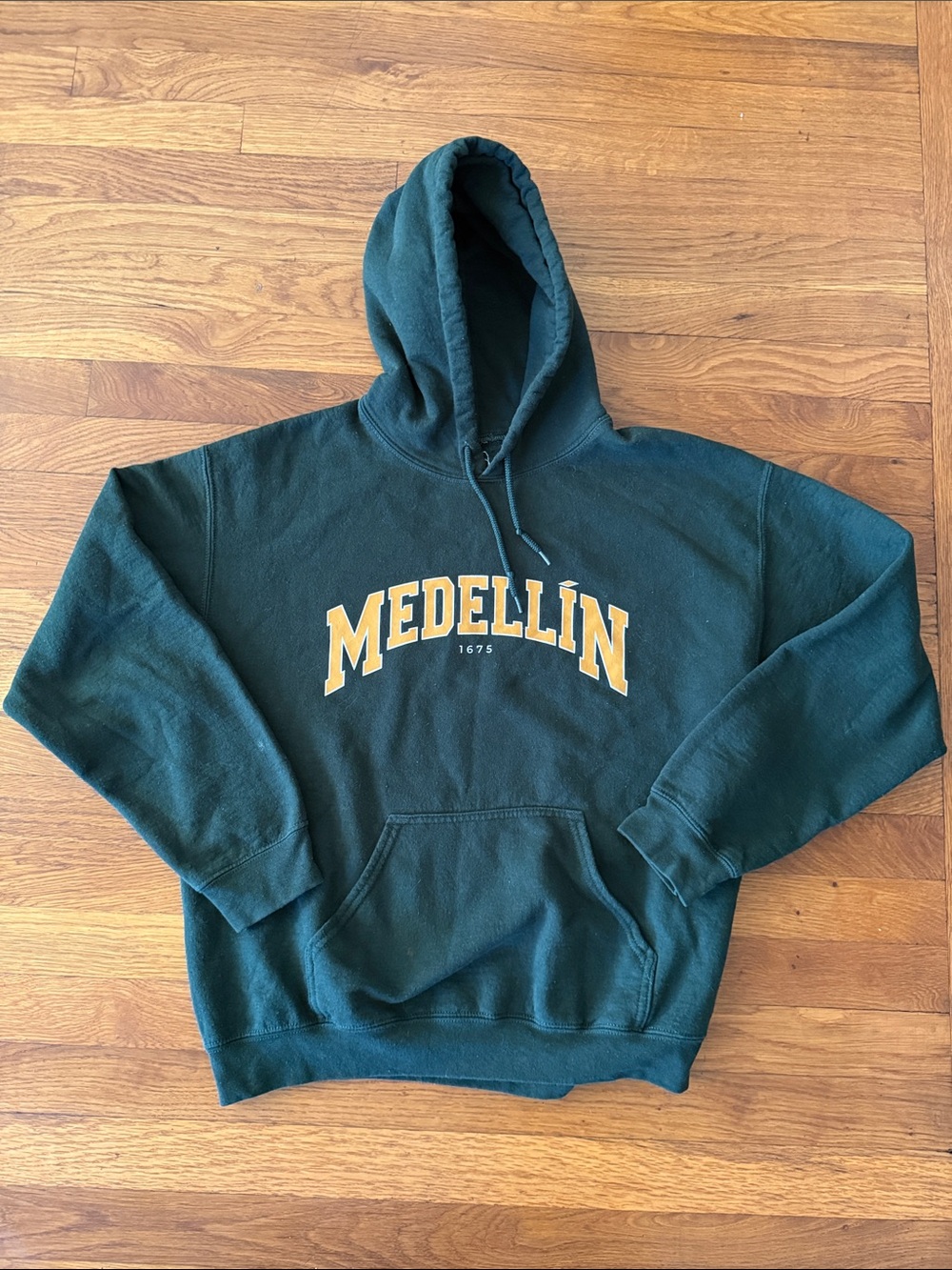 Indigo Dark Green Hoodie with Gold Medellín Logo